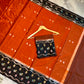 Rust Orange & Black Banarasi Soft Katan Silk Saree with Meenakari Floral Border