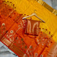 Mustard Yellow & Orange Dual-Tone Raw Mango Silk Saree with Floral Tree Zari Weaving