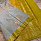 Powder Blue Dupion Silk Saree with Olive Green Border & Gold Zari Leaf Motifs