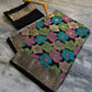 Black Nita Ambani Inspired Mashru Silk Saree with Multicolor Floral Weaving & Antique Gold Zari Border